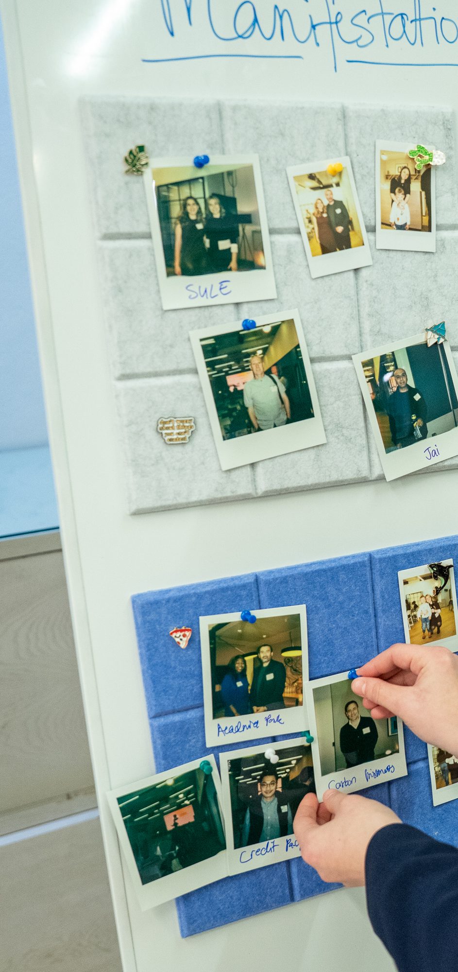 A felt board of polaroid photos of founders at a Nova Carta gathering, each labelled with their startup